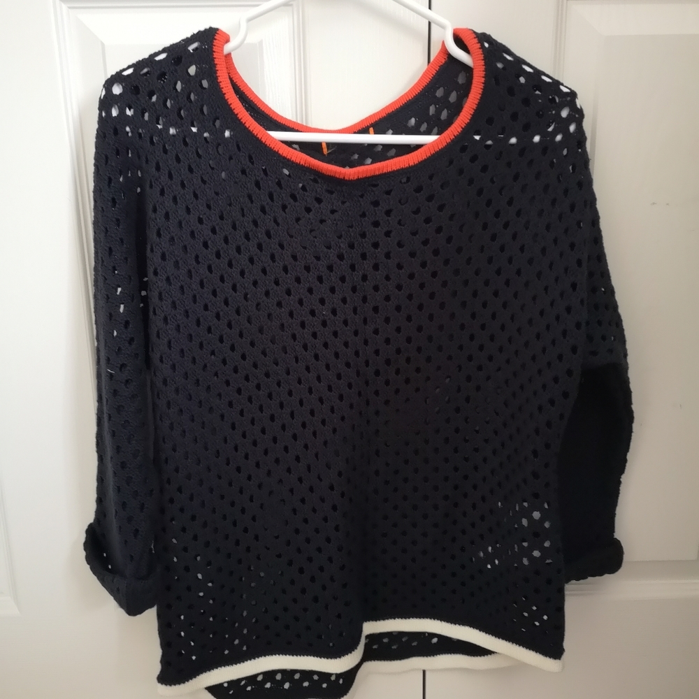 Navy knit sweater with red and white accents